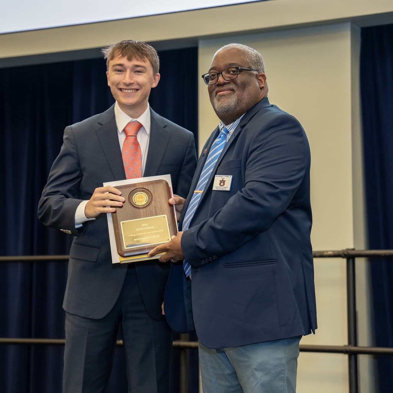 Matthew Kuehr accepting the 2026 Dean's Medal for the College of Sciences and Mathematics